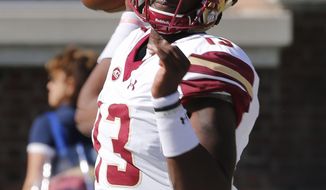 Boston College quarterback Anthony Brown (13) warms up prior to the start of an NCAA college football game against Virginia in Charlottesville, Va., Saturday, Oct. 21, 2017. (AP Photo/Steve Helber)