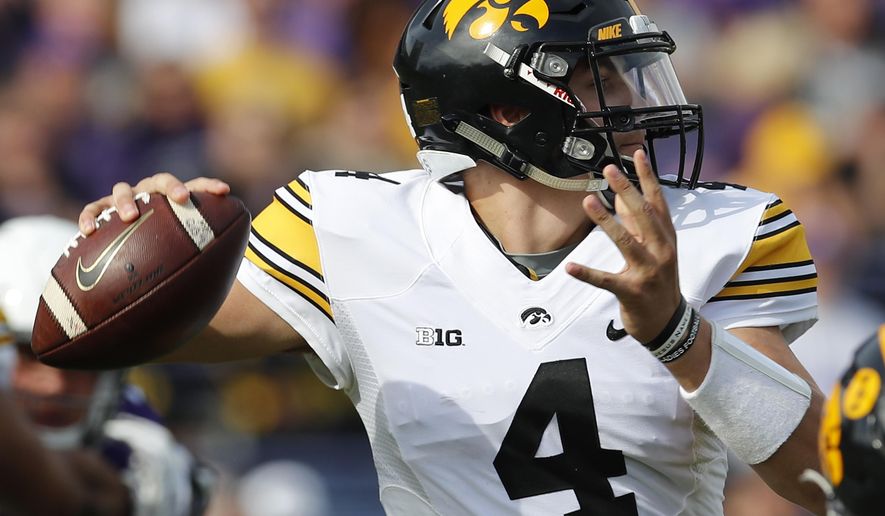Iowa's Nathan Stanley makes a pass against Northwestern during the first half of an NCAA college football game Saturday, Oct. 21, 2017, in Evanston, Ill. (AP Photo/Jim Young)