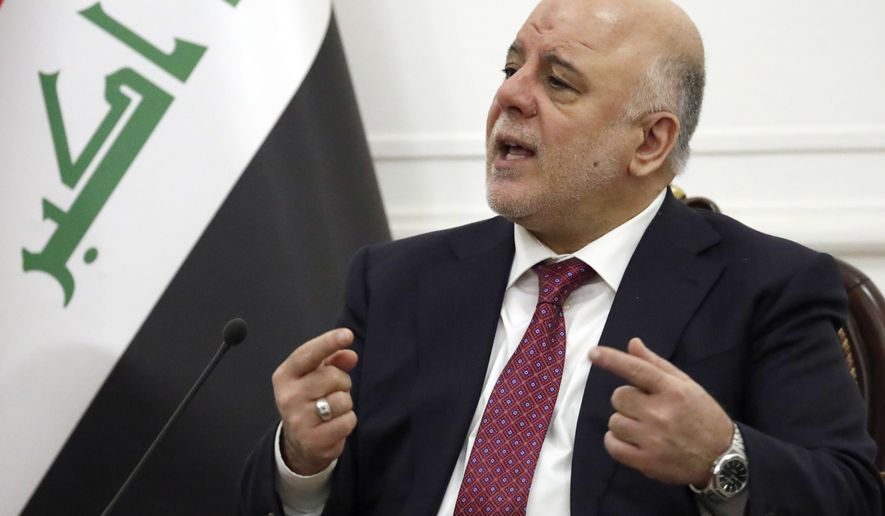 Iraqi Prime Minister Haider al-Abadi talks during his meeting with U.S. Secretary of State Rex Tillerson, Monday, Oct. 23, 2017, in Baghdad, Iraq. Tillerson made an unannounced trip to Iraq Monday, just hours after returning from a similar surprise visit to Afghanistan, meeting the top political leaders in each of the embattled countries. (AP Photo/Alex Brandon, Pool)