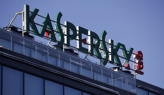 This Monday, Jan. 30, 2017, file photo shows a sign above the headquarters of Kaspersky Lab in Moscow. On Monday, Oct. 23, 2017, Kaspersky Lab said it will open up its anti-virus software to outside review as it deals with security concerns. (AP Photo/Pavel Golovkin, File)