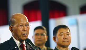 Philippine Defense Secretary Delfin Lorenzana, left, together with Armed Forces Chief Gen. Eduardo Ano, right, reads a statement announcing the Philippine troops have captured a building where pro-Islamic State group militants made their final stand in southern Marawi city and found bodies of suspected gunmen inside Monday, Oct. 23, 2017 at the ongoing ASEAN Defense Ministers&#39; Meeting in Clark, Pampanga province north of Manila, Philippines. The seizure of the building and the defeat of the militants would allowed the military to declare on Monday the end of the Marawi siege, which hundreds of black flag-waving gunmen launched exactly five months ago. (AP Photo/Bullit Marquez)
