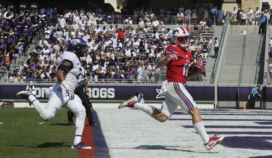 FILE - This Sept. 16, 2017 file photo shows SMU wide receiver Trey Quinn (18) beating TCU safety Niko Small (2) to the end zone for a touchdown reception during the first half an NCAA college football game in Fort Worth, Texas. SMU has completed 94 passes over the last three games. Trey Quinn has been on the receiving end of 49. (AP Photo/LM Otero)