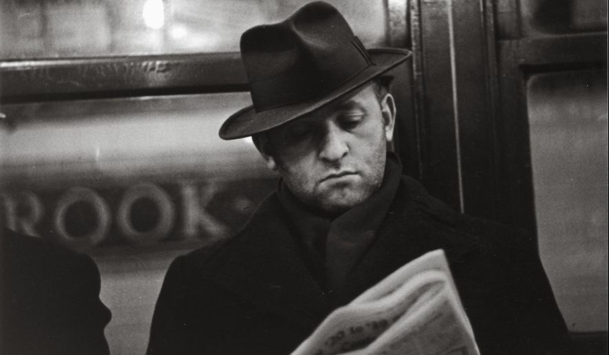 In this photo provided by the San Francisco Museum of Modern Art is the photograph by Walker Evans called "Subway Portrait" taken between 1938-1941. The photo is part of a new retrospective exhibit at the San Francisco Museum of Modern Art featuring 400 pieces of Walker's vintage prints, paintings and items from his personal collection. The exhibit was conceived as a 50-year retrospective highlighting the photographer's fascination with popular culture or vernacular — a celebration of the beauty in everyday life. (Walker Evans/San Francisco Museum of Modern Art via AP)