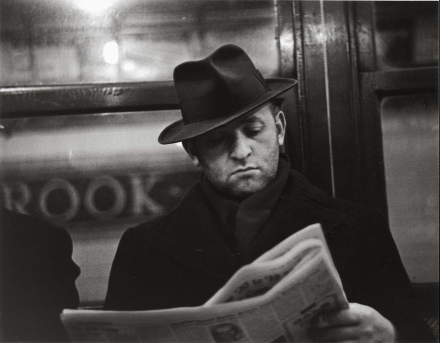 In this photo provided by the San Francisco Museum of Modern Art is the photograph by Walker Evans called "Subway Portrait" taken between 1938-1941. The photo is part of a new retrospective exhibit at the San Francisco Museum of Modern Art featuring 400 pieces of Walker's vintage prints, paintings and items from his personal collection. The exhibit was conceived as a 50-year retrospective highlighting the photographer's fascination with popular culture or vernacular — a celebration of the beauty in everyday life. (Walker Evans/San Francisco Museum of Modern Art via AP)