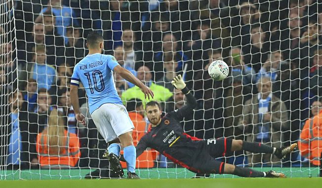 Manchester City&#x27;s Sergio Aguero scores the winning penalty  during the English League Cup soccer match between Manchester City and Wolverhampton Wanderers at the Etihad Stadium, Manchester, England, Tuesday, Oct. 24, 2017. (Tim Goode/PA via AP)
