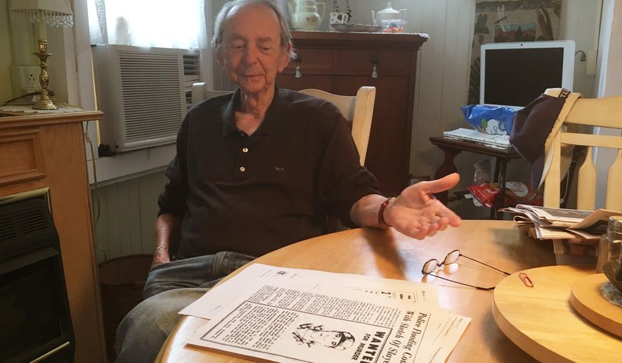 This Oct. 2017 photo shows Vernon Gantz, 80, looking at the composite sketch of the man suspected of attacking Mabel Kretshmar in 1959 at his home in Perkasie, Pa. Police questioned at least 140 transients and area residents, including a 22-year-old Gantz, during an extensive manhunt following the crime. Gantz was ruled out as a suspect, as was everyone else police had spoken with. The case remains unsolved. (Christian Menno/Bucks County Courier Times via AP)