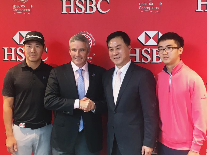 PGA Tour commissioner Jay Monahan, center left, shakes hands with Zhang Xiaoning, president of the China Golf Association, after announcing a deal at the WGC-HSBC Champions golf tournament in Shanghai on Wednesday, Oct. 25, 2017, to resume the PGA Tour China Series. They are flanked by Zhang Xinjun, far left, and Dou Zecheng, who used the China series as a springboard to become the first Chinese players to earn full PGA Tour cards. (AP Photo/Doug Ferguson) **FILE**