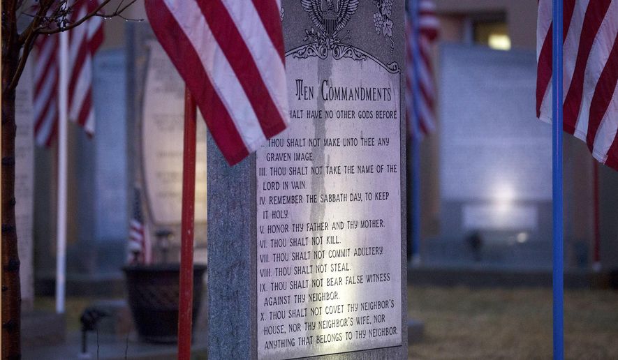The Bloomfield Ten Commandments memorial is pictured, Monday, Feb. 13, 2017 at Bloomfield City Hall in Bloomfoeld,, N.M The U.S. Supreme Court on Monday, Oct. 16, 2017, sided with a lower court, the the 10th U.S. Circuit Court of Appeals, that ordered Bloomfield to remove a Ten Commandments monument from the lawn outside City Hall. (Jon Austria/The Daily Times via AP)