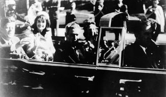 This image provided by the Warren commission, shows Warren Commission Exhibit No. 697, President John F. Kennedy at the extreme right on rear seat of his limousine during Dallas, motorcade on Nov. 22, 1963. His wife, Jacqueline, beside him, Gov. John Connally of Texas and his wife were on jump seats in front of the president. President Donald Trump is caught in a push-pull on new details of Kennedy’s assassination, jammed between students of the killing who want every scrap of information and intelligence agencies that are said to be counseling restraint.  How that plays out should be known on Oct. 26, 2017, when long-secret files are expected to be released. (Warren Commission via AP)