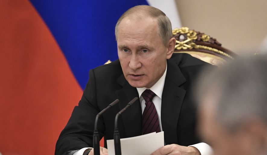 Russian President Vladimir Putin heads the Security Council meeting in Moscow, Russia, Thursday, Oct. 26, 2017. (Alexei Nikolsky, Sputnik, Kremlin Pool Photo via AP)