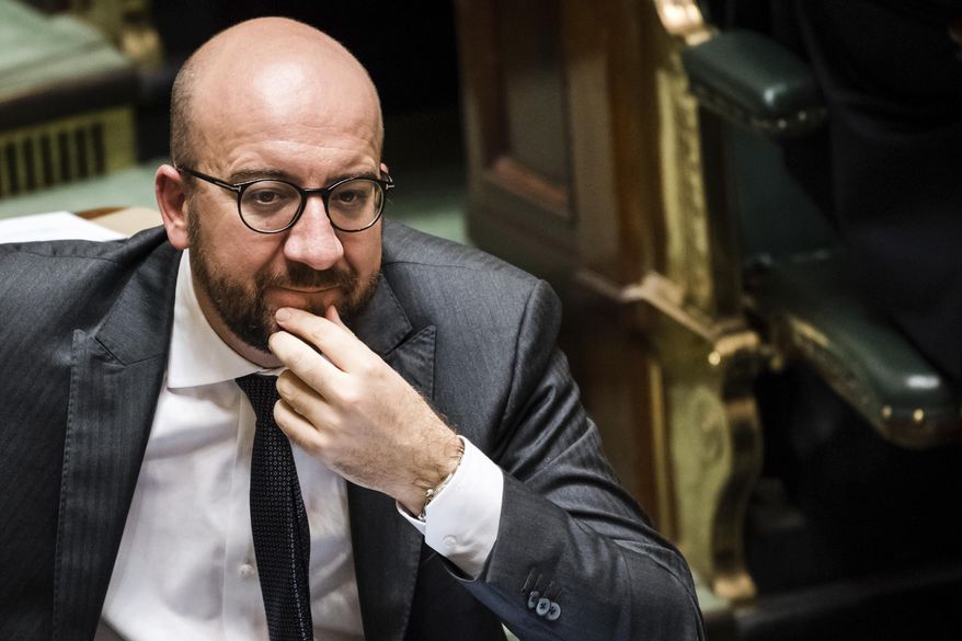 Belgian Prime Minister Charles Michel listens to the conclusions of the March 22, 2016 Brussels' attacks research committee at the Belgian federal parliament in Brussels on Thursday, Oct. 26, 2017. (AP Photo/Geert Vanden Wijngaert)