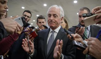 In this Oct. 25, 2017, file photo, Senate Foreign Relations Committee Chairman Bob Corker, R-Tenn., talks to reporters as he returns to his office from a vote, on Capitol Hill in Washington. (AP Photo/J. Scott Applewhite, File)