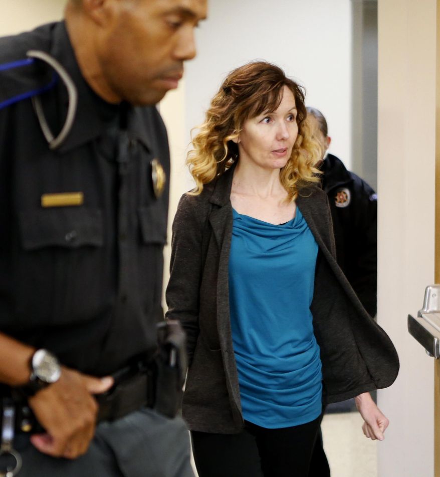 Melissa Clark, a former daycare owner, enters the courtroom on Thursday, Oct. 26, 2017, in Norman, Okla. Clark pleaded not guilty in the July 2016 death of Braelyn Zachary, who prosecutors say was shaken by Clark. Clark has said she accidentally dropped the baby. (Steve Sisney/The Oklahoman via AP)