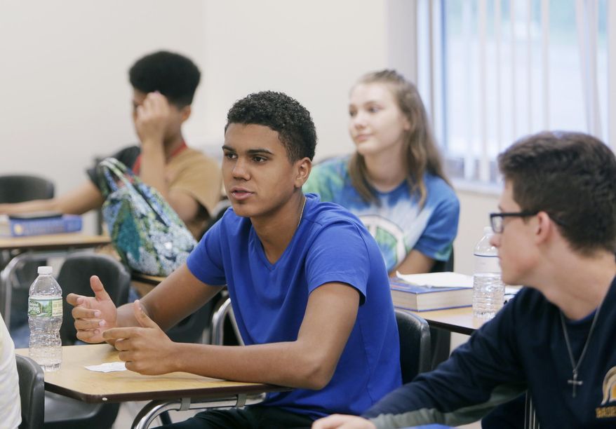 In this Wednesday, Oct. 18, 2017 photo, during a discussion about smartphone technology in Tiffany Southwell&#39;s English Literature class, Sebastian Maceda, 15, talks about when not using his smartphone, he was engaged in conversations with his family at home at George M. Steinbrenner High School in Lutz, Fla. (Octavio Jones/Tampa Bay Times via AP) **FILE**