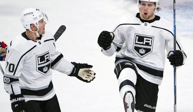 Los Angeles Kings left wing Adrian Kempe, right, celebrates his goal with teammate Tanner Pearson during the first period of an NHL hockey game against the Montreal Canadiens, Thursday, Oct. 26, 2017 in Montreal. (Ryan Remiorz/The Canadian Press via AP)