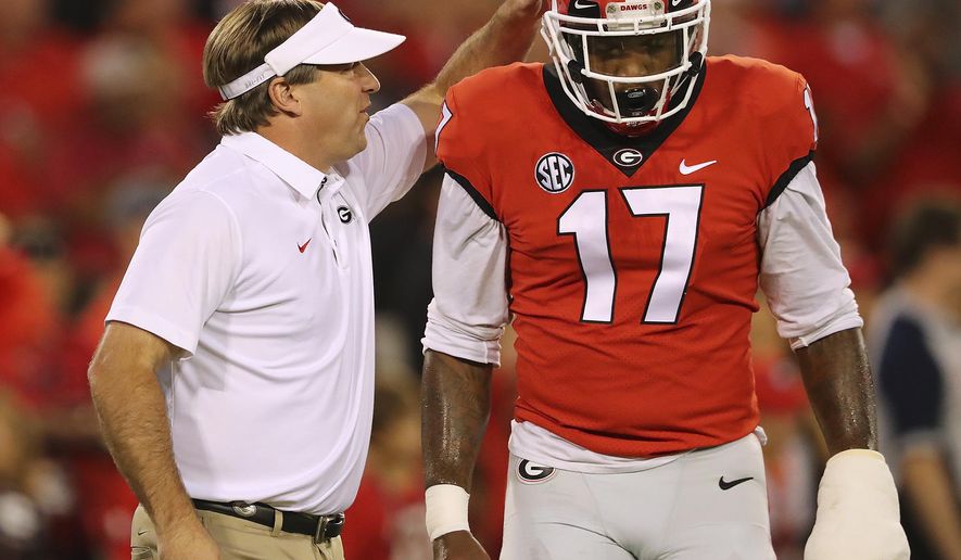 Georgia head coach Kirby Smart encourages linebacker Davin Bellamy as they prepare to play Missouri in an NCAA college football game, Saturday, Oct. 14, 2017, in Athens, Ga. (Curtis Compton/Atlanta Journal-Constitution via AP)