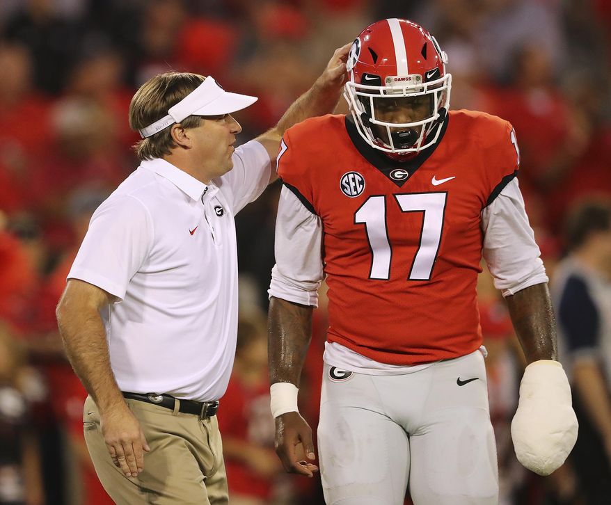 Georgia head coach Kirby Smart encourages linebacker Davin Bellamy as they prepare to play Missouri in an NCAA college football game, Saturday, Oct. 14, 2017, in Athens, Ga. (Curtis Compton/Atlanta Journal-Constitution via AP)