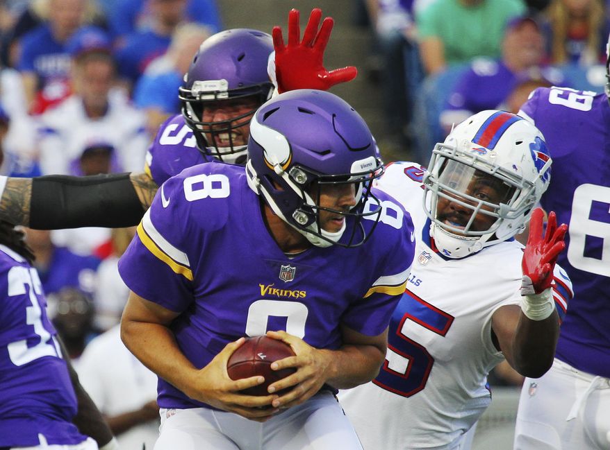 FILE - In this Aug. 10, 2017, file photo, Minnesota Vikings quarterback Sam Bradford (8) reacts before his is sacked by Buffalo Bills defensive end Jerry Hughes (55) during the first half of a preseason NFL football game, in Orchard Park, N.Y. Try reminding Jerry Hughes how the Buffalo Bills were supposed to be tanking in light of how deep their offseason purge had become in August, and the team's top pass-rusher will shake his head in disgust. (AP Photo/Jeffrey T. Barnes, File)