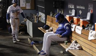 Los Angeles Dodgers relief pitcher Kenley Jansen sits in the dugout during the ninth inning of Game 2 of baseball&#39;s World Series against the Houston Astros Wednesday, Oct. 25, 2017, in Los Angeles. (AP Photo/Matt Slocum)