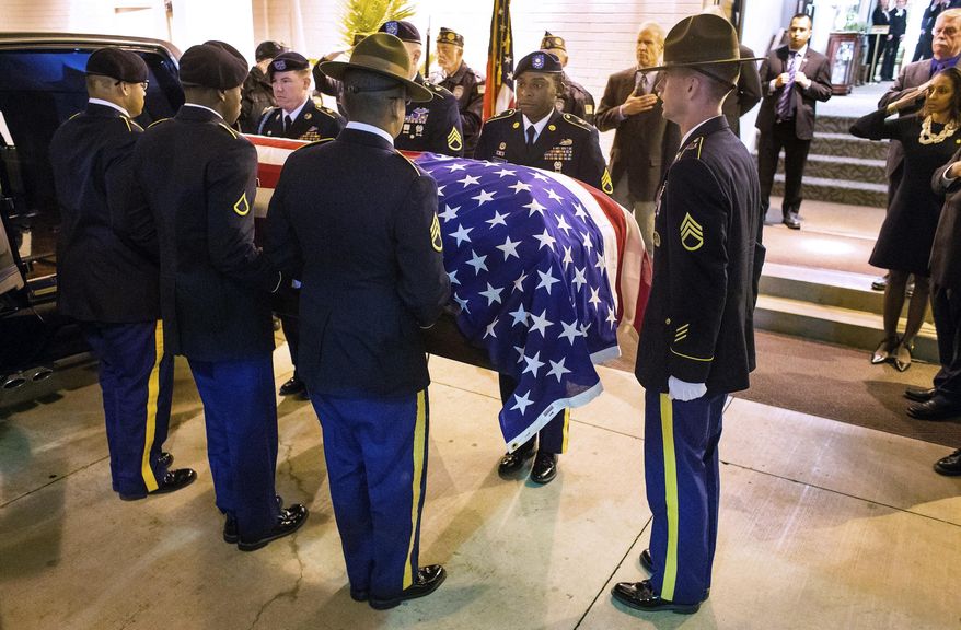 In this Oct. 25, 2017 photo, a Fort Leonard Wood Honors Team escorts the flag-draped casket with the remains of Army Staff Sgt. Michael Aiello into Staab Funeral Home in Springfield, Ill. Aiello went missing Sept. 30 1944, during intense fighting near the bridge at Nijmegen in the Netherlands. About eight years ago, the military disinterred a set of remains that were later identified as Aiello. Family members in the Springfield area provided DNA samples to confirm the identity and arrangements were made to transport the remains back to Springfield this week. (Ted Schurter /The State Journal-Register via AP)