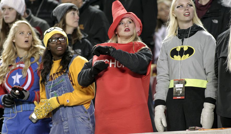 FILE  In this Oct. 31, 2015 file photo, Minnesota fans celebrate Halloween during the first 