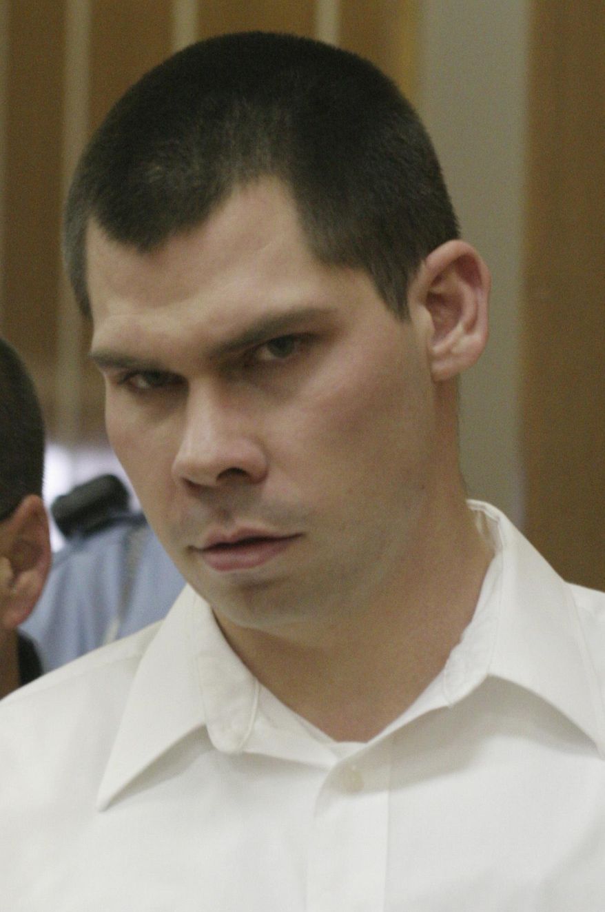 FILE - In this Jan. 17, 2007 file photo, Justin Eugene Thurber enters the Cowley County District Courthouse in Winfield, Kan. Thurber is accused of kidnapping, raping and killing Jodi Sanderholm of Arkansas City, Kan. The Kansas State Supreme Court heard arguments Friday, Oct. 27, 2017 in an appeal from Thurber's attorneys, to spare him from being executed for the college student's murder over questions about whether he is developmentally disabled. A ruling will come later. (AP Photo/ Donita Clausen, Pool File)