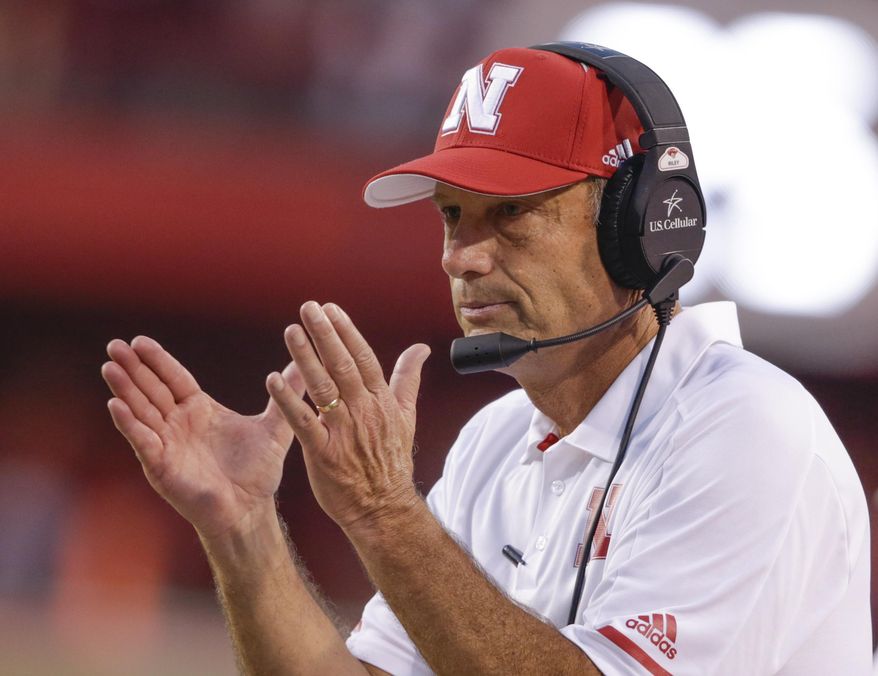 FILE - In this Sept. 2, 2017, file photo, Nebraska head coach Mike Riley applauds after a play review confirmed a touchdown by wide receiver Stanley Morgan Jr. during the first half of an NCAA college football game against Arkansas State in Lincoln, Neb. Jeff Brohm came to Purdue to win. The first-year coach still believes he can even with some midseason missteps. Nebraska coach Mike Riley understands. The Boilermakers and Cornhuskers have both lost back-to-back games. They both need three wins to become bowl eligible. And both know that the turnaround must begin Saturday night, Oct. 28, 2017 in West Lafayette, Indiana. (AP Photo/Nati Harnik, file)