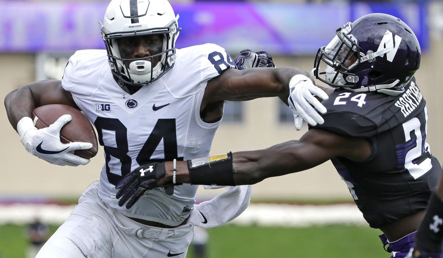 FILE - In this Saturday, Oct. 7, 2017 file photo, Penn State wide receiver Juwan Johnson, left, runs with the ball against Northwestern corner back Montre Hartage during the first half of an NCAA college football game in Evanston, Ill. No. 2 Penn State relies on a deep passing game, with receivers winning one-on-one matchups, to loosen up the line of scrimmage for start Saquon Barkley. The Nittany Lions are hoping to exploit some mismatches with big targets like Mike Gesicki and Juwan Johnson when they face No. 6 Ohio State on Saturday, Oct. 28, 2017. (AP Photo/Nam Y. Huh, File)
