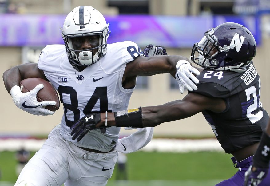 FILE - In this Saturday, Oct. 7, 2017 file photo, Penn State wide receiver Juwan Johnson, left, runs with the ball against Northwestern corner back Montre Hartage during the first half of an NCAA college football game in Evanston, Ill. No. 2 Penn State relies on a deep passing game, with receivers winning one-on-one matchups, to loosen up the line of scrimmage for start Saquon Barkley. The Nittany Lions are hoping to exploit some mismatches with big targets like Mike Gesicki and Juwan Johnson when they face No. 6 Ohio State on Saturday, Oct. 28, 2017. (AP Photo/Nam Y. Huh, File)