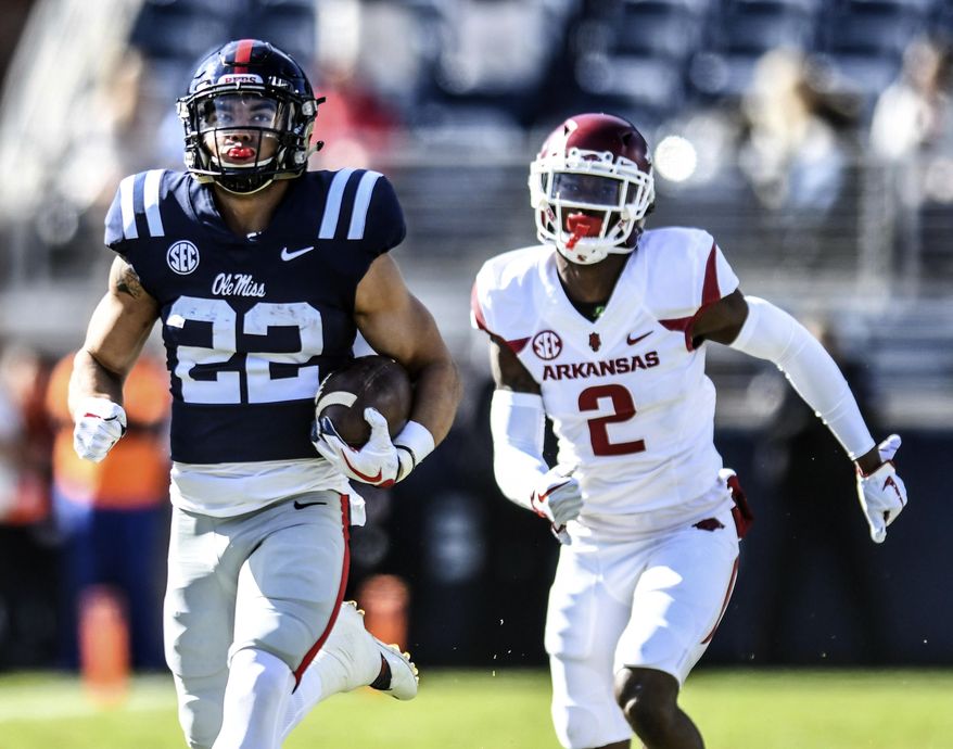 Mississippi running back Jordan Wilkins (22) outruns Arkansas defensive back Kamren Curl (2) to scores a touchdown during an NCAA college football game at Vaught-Hemingway Stadium in Oxford, Miss., Saturday, Oct. 28, 2017. (Bruce Newman/The Oxford Eagle via AP)
