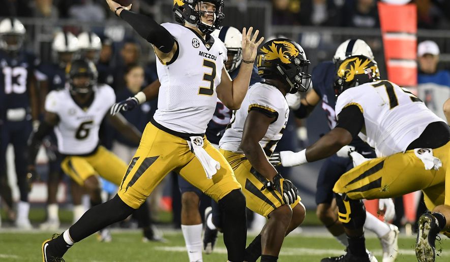 Missouri quarterback Drew Lock (3) throws during the first half of an NCAA college football game against Connecticut, Saturday, Oct. 28, 2017, in East Hartford, Conn. (AP Photo/Jessica Hill)