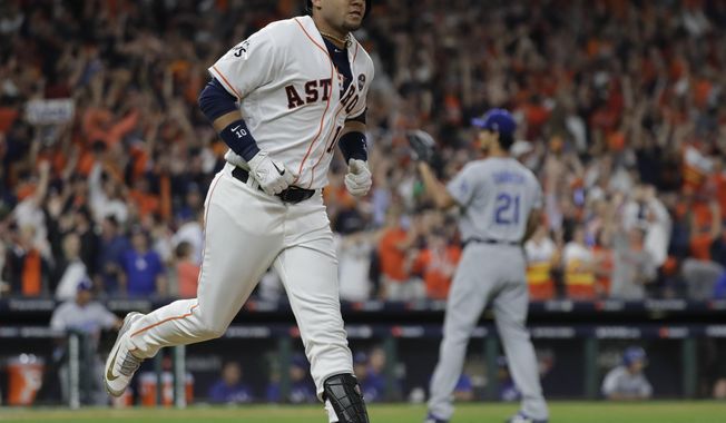 Houston Astros&#x27; Yuli Gurriel reacts after hitting a home run during the first inning of Game 3 of baseball&#x27;s World Series against the Los Angeles Dodgers Friday, Oct. 27, 2017, in Houston. (AP Photo/David J. Phillip)