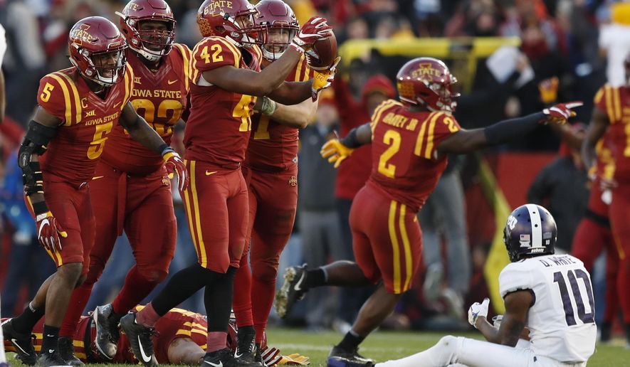 Iowa State linebacker Marcel Spears Jr. (42) celebrates with teammates after intercepting a pass in front of TCU wide receiver Desmon White (10) during the second half of an NCAA college football game, Saturday, Oct. 28, 2017, in Ames, Iowa. Iowa State won 14-7. (AP Photo/Charlie Neibergall)
