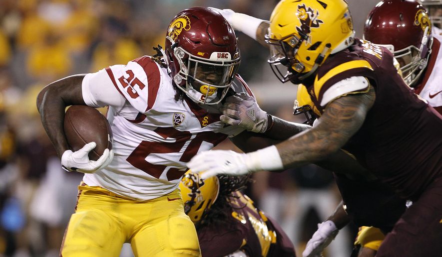 Southern California running back Ronald Jones II runs the ball as Arizona State's Jay Jay Wilson closes in to make the tackle during the first half of an NCAA college football game, Saturday, Oct. 28, 2017, in Tempe, Ariz. (AP Photo/Ralph Freso)