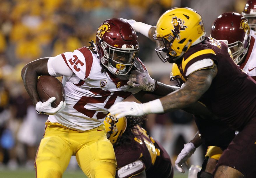 Southern California running back Ronald Jones II runs the ball as Arizona State's Jay Jay Wilson closes in to make the tackle during the first half of an NCAA college football game, Saturday, Oct. 28, 2017, in Tempe, Ariz. (AP Photo/Ralph Freso)