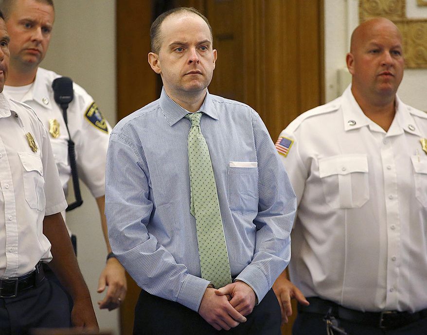 FILE - In this July 21, 2015 photo, officers lead Radoslaw Czerkawski into court for sentencing in Dedham, Mass., after he was convicted of larceny. A trial for Czerkawski, who is charged with abusing a dog so severely it had to be euthanized, is scheduled to start Tuesday, Oct. 24, 2017, in Massachusetts. (Greg Derr/The Quincy Patriot Ledger via AP, File)