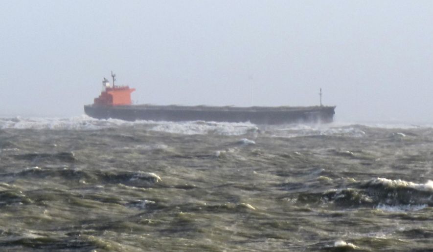 The photo provided by Germany's Central command for maritime emergencies shows the Panama-flagged bulk carrier Glory Amsterdam which ran aground off the shore of the German island of Langeoog on Sunday, Oct. 29, 2017. Germany was hit by a heavy storm on Sunday. (Central command for maritime emergencies via AP)