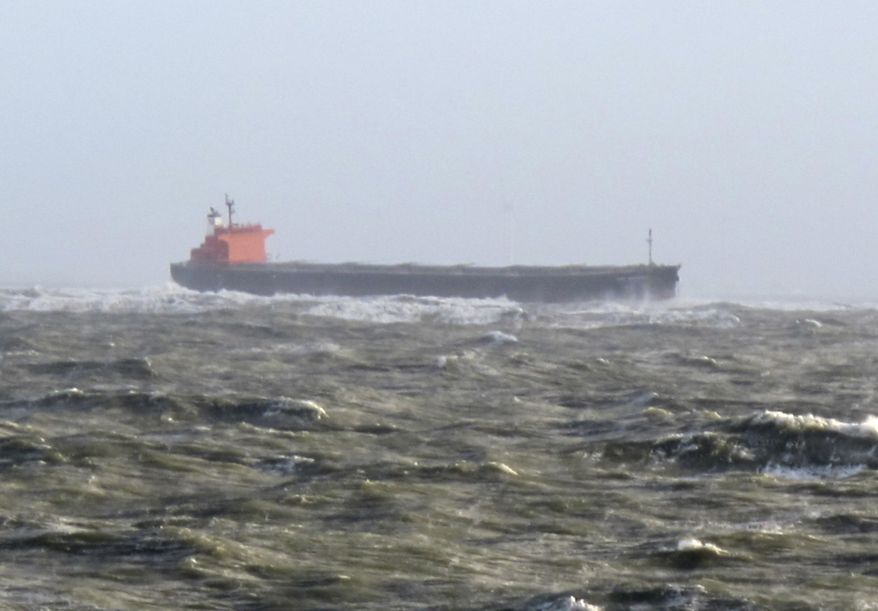 The photo provided by Germany's Central command for maritime emergencies shows the Panama-flagged bulk carrier Glory Amsterdam which ran aground off the shore of the German island of Langeoog on Sunday, Oct. 29, 2017. Germany was hit by a heavy storm on Sunday. (Central command for maritime emergencies via AP)