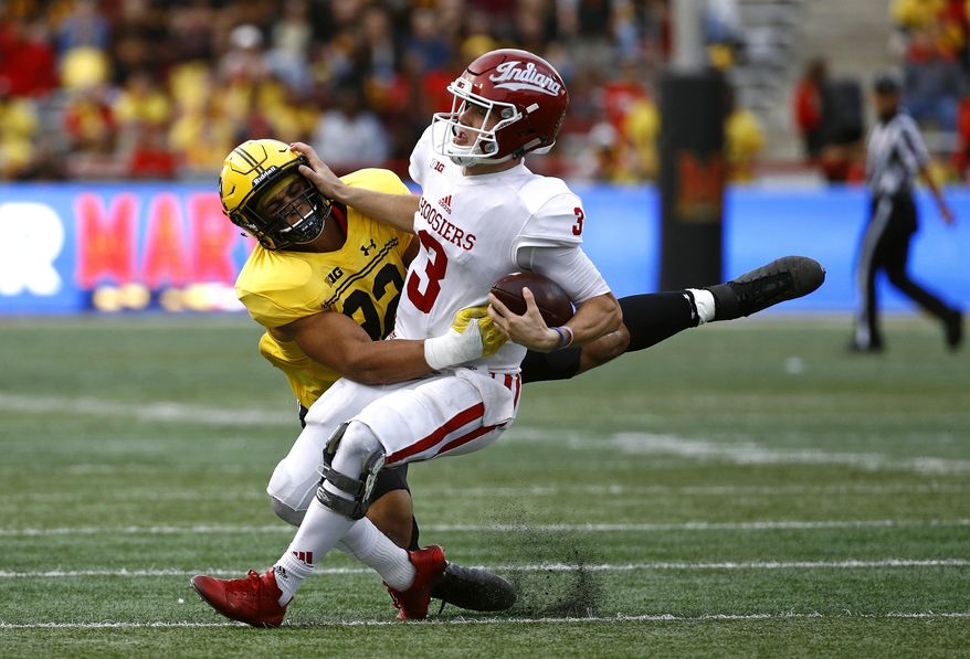 Maryland defensive lineman Chandler Burkett, left, sacks Indiana quarterback Peyton Ramsey in the first half of an NCAA college football game in College Park, Md., Saturday, Oct. 28, 2017. (AP Photo/Patrick Semansky)