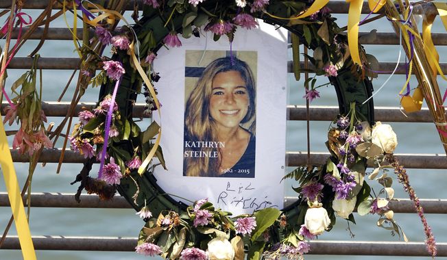 This July 17, 2015, file photo shows flowers and a portrait of Kate Steinle displayed at a memorial site on Pier 14 in San Francisco, Calif. The bullet that killed Kate Steinle two years ago ricocheted off the ground about 100 yards away before hitting her in the back and later launching a criminal case at the center of a national immigration debate. A San Francisco police officer who helped supervise the investigation testified about the bullet’s trajectory Monday, Oct. 30, 2017 at Zarate&#x27;s trial. (Paul Chinn /San Francisco Chronicle via AP, File) **FILE**