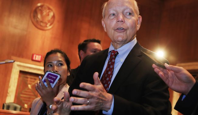 Internal Revenue Service (IRS) Commissioner John Koskinen talks to reporters on Capitol Hill in Washington, Wednesday, July 26, 2017 following his testimony before the Senate Appropriations subcommittee hearing on the fiscal 2018 federal budget. (AP Photo/Manuel Balce Ceneta)