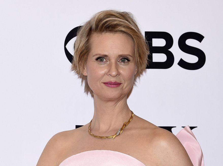 FILE - In this June 11, 2017 file photo, Cynthia Nixon poses in the press room at the 71st annual Tony Awards in New York. Nixon will host the National Book Awards ceremony on Nov. 15 in New York. (Photo by Evan Agostini/Invision/AP, File)