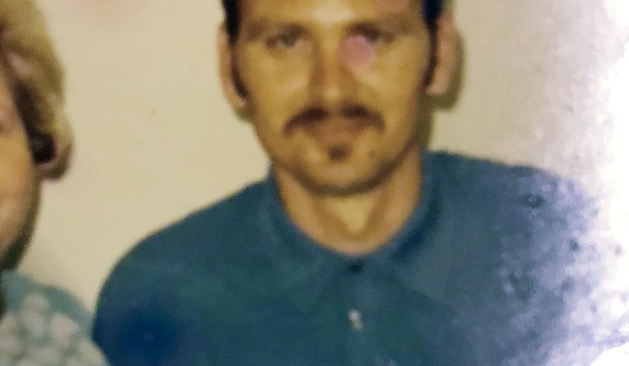 This undated photo provided by the Downey family shows John Downey posing for a photo at United States Penitentiary, Leavenworth in Leavenworth, Kan. A new FBI technique for identifying bodies using low-quality fingerprints enabled authorities to identify human remains found in Des Moines, Iowa, in 1984, as Downey. Nearly 200 other bodies across the country have been identified through the FBI effort. (Downey family via AP)