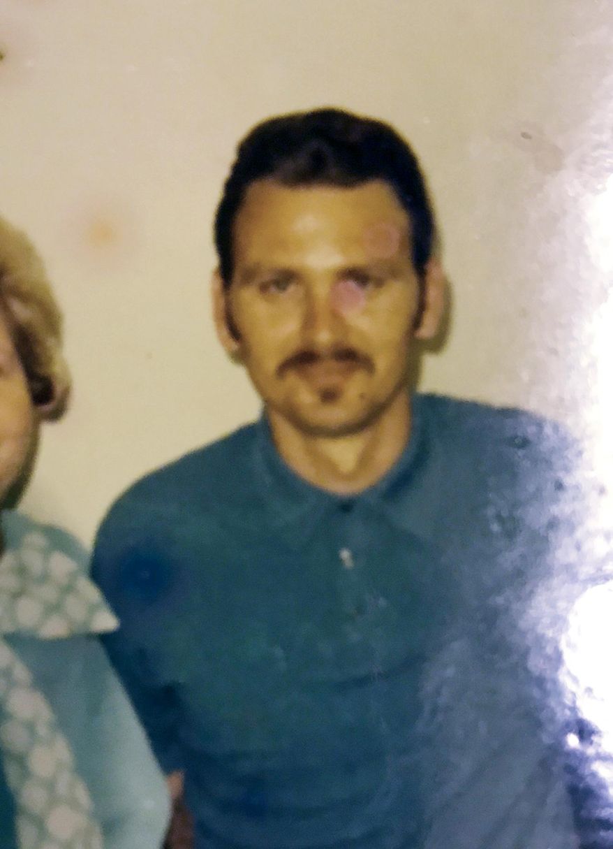 This undated photo provided by the Downey family shows John Downey posing for a photo at United States Penitentiary, Leavenworth in Leavenworth, Kan. A new FBI technique for identifying bodies using low-quality fingerprints enabled authorities to identify human remains found in Des Moines, Iowa, in 1984, as Downey. Nearly 200 other bodies across the country have been identified through the FBI effort. (Downey family via AP)