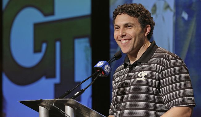 FILE - In this Oct. 25, 2017, file photo, Georgia Tech head coach Josh Pastner answers a question during the Atlantic Coast Conference men's NCAA college basketball media day in Charlotte, N.C. Josh Pastner's first season at Georgia Tech went much better than expected. Heading into his second season as coach, Pastner knows his program is facing much greater expectations. (AP Photo/Chuck Burton, File)