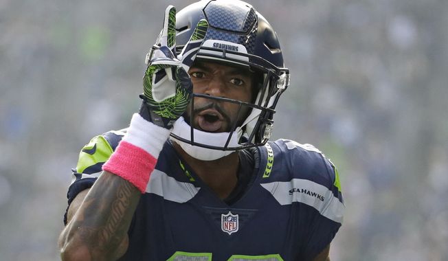 Seattle Seahawks wide receiver Paul Richardson celebrates in the first half of an NFL football game after score his second touchdown against the Houston Texans, Sunday, Oct. 29, 2017, in Seattle. (AP Photo/Elaine Thompson)