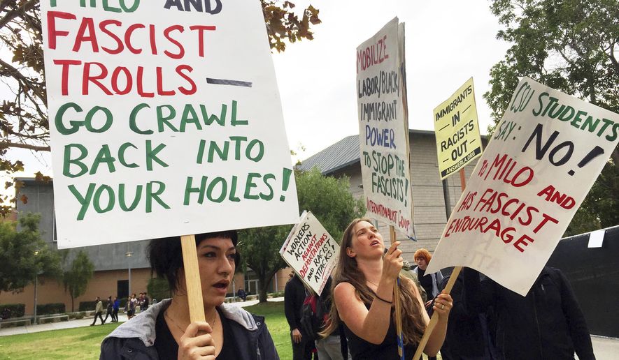 Demonstrators protest outside a speech by conservative provocateur Milo Yiannopoulos, sponsored by a Republican student group at California State University, Fullerton, Tuesday, Oct. 31, 2017. At least one fight broke out and several people were arrested. They were mostly peaceful, but one woman protesting the event attacked a Yiannopoulos supporter with punches before a third person subdued her with pepper spray. (AP Photo/Amanda Lee Myers)