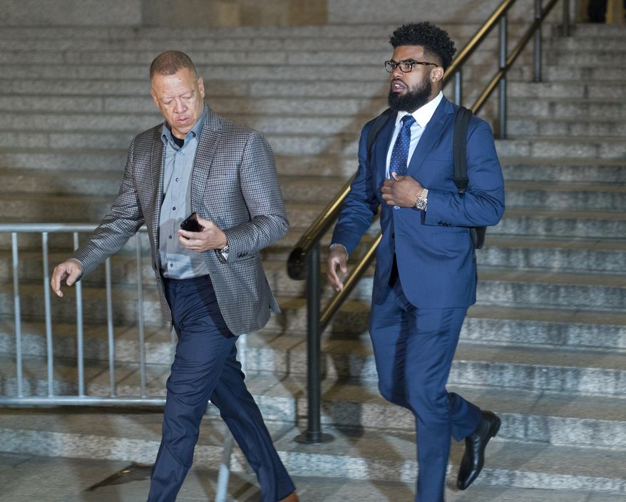 Dallas Cowboys star Ezekiel Elliott, right, exits federal court after a hearing Monday, Oct. 30, 2017 in New York. Elliott is seeking to have his six game suspension by the NFL postponed. (AP Photo/Craig Ruttle)