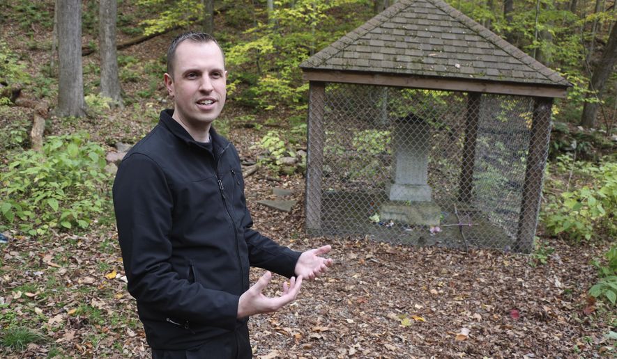 Former ghost hunter Walter Hutsky Jr. recalls legends at the Lost Children of the Alleghenies Monument, also known as the Cox Monument, in Blue Knob State Park near Pavia, Pa., Thursday, Oct.26, 2017. The bodies of two lost boys, ages seven and five, were found here in May, 1856, after they went missing ten days prior. A man unfamiliar to the area who dreamed twice of the location, led a search party straight to them. Some think the area in haunted.(Randy Griffith/Tribune-Democrat via AP)