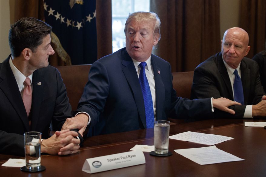 President Donald Trump speaks during a meeting on tax policy with Republican lawmakers in the Cabinet Room of the White House, Thursday, Nov. 2, 2017, in Washington, with House Speaker Paul Ryan of Wis., and Chairman of the House Ways and Means Committee Rep. Kevin Brady, R-Texas, right. (AP Photo/Evan Vucci)